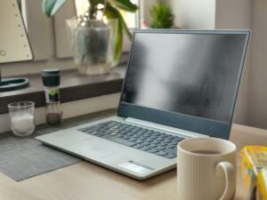 Laptop with coffee on the table with affiliate disclosure