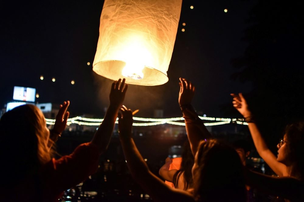 Loy Krathong 2025 festival celebration in Thailand with krathongs on water
